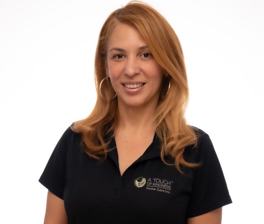 Headshot of nurse at Miami photo studio with her uniform looking professional
