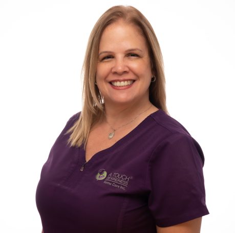 A nurse in her uniform at Miami photo studio posing for her headshot looking professional